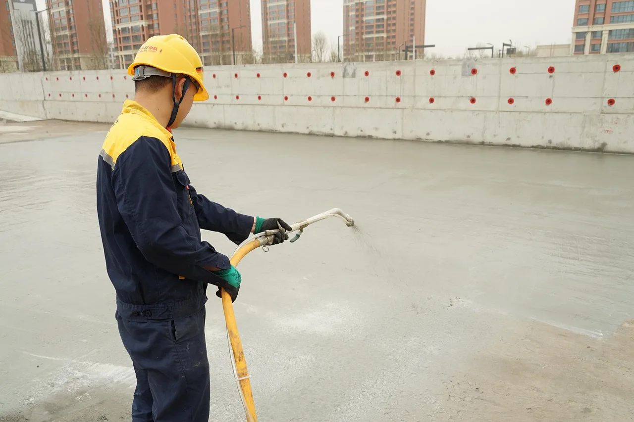 waterproofing, workers, construction site, roof top, men, working, spraying, safety gear, pressure spray, waterproofing, waterproofing, waterproofing, waterproofing, waterproofing. How OSHA rules shape flooring installer safety on New York City jobs
